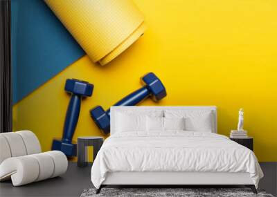 top view of blue fitness mat with dumbbells on yellow background, panoramic shot Wall mural