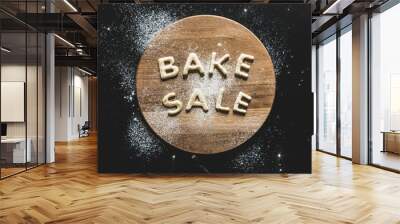 top view of cookies in forms of letters with powdered sugar, cookie dough Wall mural