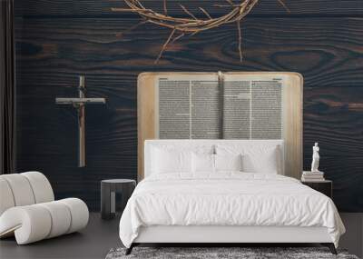 top view of crown of thorns with cross and bible on table Wall mural