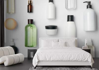 top view of different cosmetic bottles and container on white background Wall mural