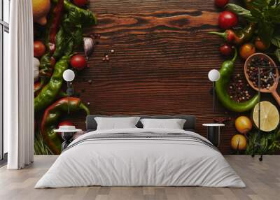 top view of fresh healthy vegetables and spices on wooden surface Wall mural