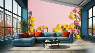 top view of fresh pink tulips, blue hyacinths and yellow daffodils on pink background Wall mural