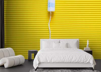 top view of hygienic tampon on bright yellow textured background. Wall mural