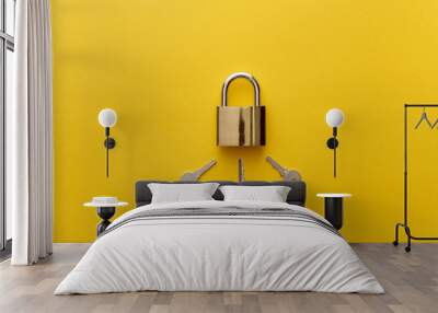 top view of metal padlock with keys on yellow background Wall mural