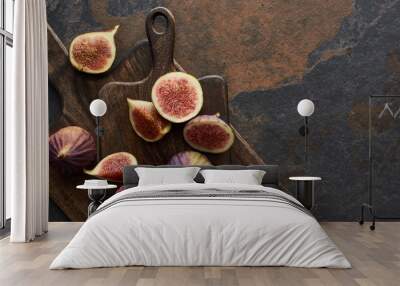 top view of ripe whole and cut delicious figs and cutting boards on stone background Wall mural