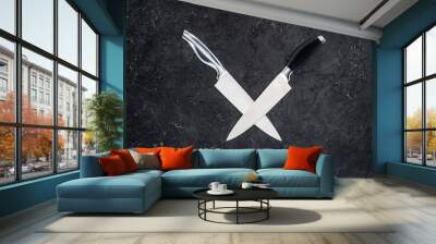 top view of two kitchen knives arranged on black surface Wall mural