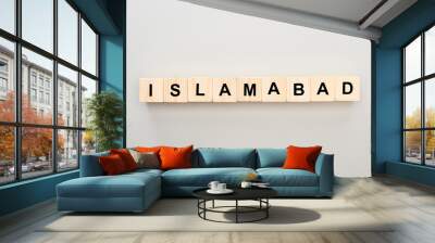 top view of wooden blocks with Islamabad lettering on grey background Wall mural