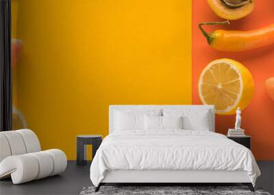 top view of yellow fruits and vegetables on orange background with copy space, panoramic shot Wall mural