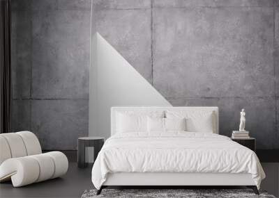 triangle shape carton near grey wall with copy space Wall mural