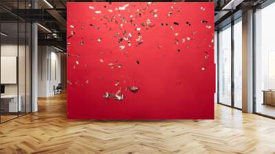 view of golden christmas confetti isolated on red Wall mural