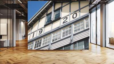 historic facade finger wharf building timber 1920 windows blue sky looking up old  Wall mural