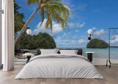 Tropical beach palm tree and island view Wall mural