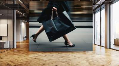 Blurred motion of woman walking and holding paper shopping bag in back view Wall mural