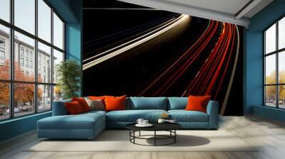 Cars moving fast on a night highway (motion blurred image) Wall mural