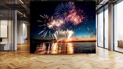 holiday fireworks above water with reflection on the black sky background Wall mural