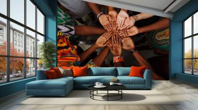 Palms up hands of happy group of multinational African, latin american and european people which stay together in circle Wall mural