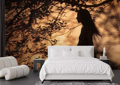 Asian Woman Walking Under Tree at Golden Hour An Impressionist Silhouette in Natures Embrace Wall mural