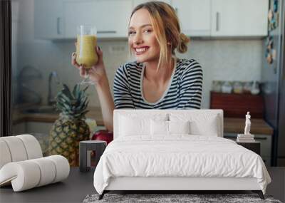 Happy smiling  healthy woman drinking smoothie Wall mural