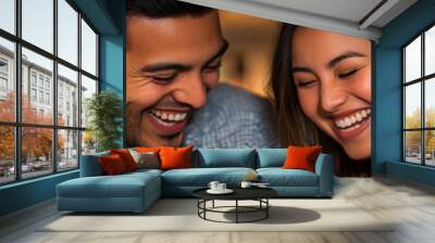 Hispanic man and Asian woman laughing together over a plate of food Wall mural