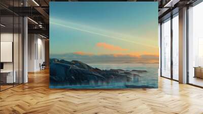 Lonely Lighthouse: A solitary sentinel stands atop a rocky promontory, its beam of light sweeping across the endless expanse of ocean, searching for something that may never come back. Wall mural