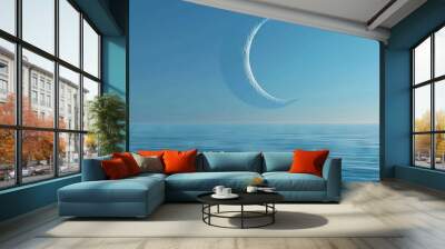 The Earth's crescent moon hangs in the sky, reflecting soft blue light upon an endless ocean. Wall mural