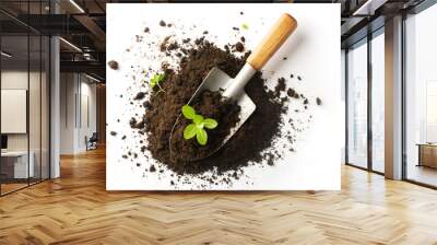 Top view - gardening shovel on round pile of organic topsoil isolated on a white background. Young shoots grow.. Spacy text. Wall mural