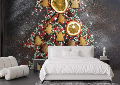 Abstract christmas tree made from festive treats and spices.Top view with copy space. Wall mural