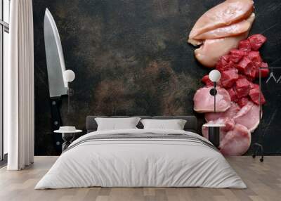 Assortment of raw fresh white and red meat : chicken breast, beef and pork fillet.Top view with copy space. Wall mural