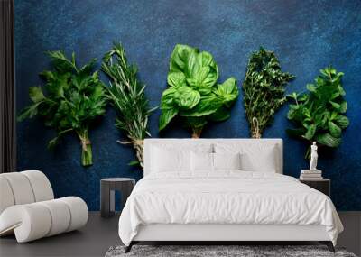 Bunchs of variety fresh aromatic herbs. Top view with copy space. Wall mural