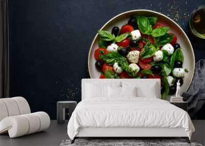 Caprese - traditional italian vegetable salad with mozzarella cheese. Top view with copy space. Wall mural