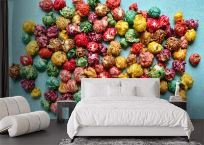 Food background with colorful caramel candy popcorn . Top view with copy space. Wall mural