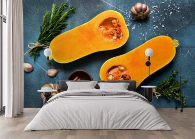 Halves of raw organic butternut squash with ingredients for making . Top view with copy space. Wall mural