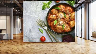 Meatballs in tomato sauce in a skillet.Top view. Wall mural