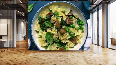 Pasta farfalle with mushrooms, spinach and green pea. Top view with copy space. Wall mural