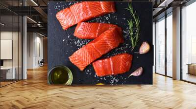 Raw fresh organic trout fillet with ingredients for cooking. Top view with copy space. Wall mural