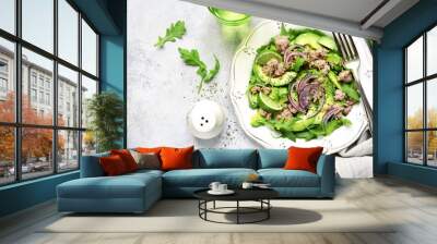 Tuna salad with avocado and arugula.Top view with copy space. Wall mural