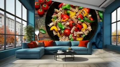 Whole wheat fusilli pasta with grilled vegetables. Top view with copy space. Wall mural