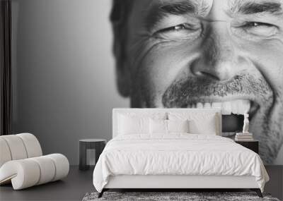 a Middle-Aged Man Laughing Heartily in Black and White Wall mural