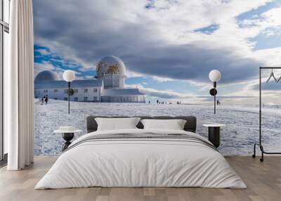 landscape with snow, panorama of the tower in serra da estrela natural park with silhouettes of peop Wall mural