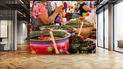 Mexican woman cooking a traditional dish Wall mural