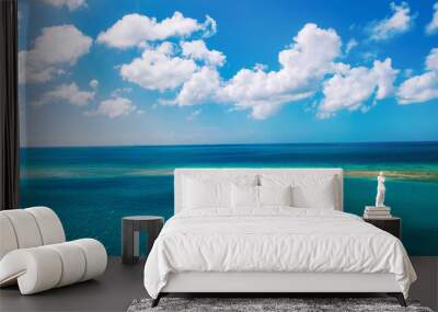 Beautiful turquoise sea perfect blue sky white clouds Wall mural