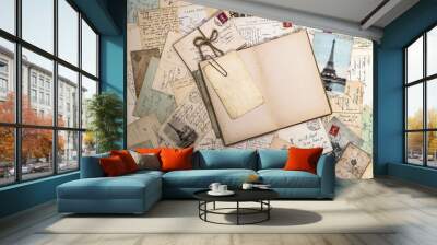 old postcards and open book. nostalgic vintage background Wall mural