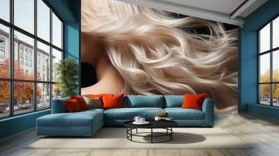 Young woman with long beautiful blonde hair on dark background. Glossy wavy white hair Wall mural