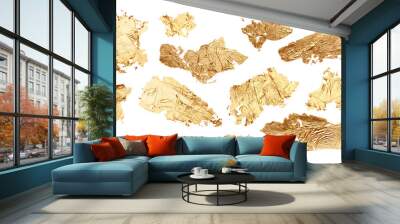 Gold glitter and bronze color blot. Abstract torn piece of metal leaf (potal) paper on white background. Wall mural