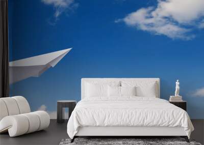 paper plane in the blue sky. Wall mural