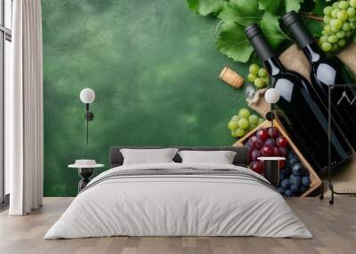 A stylish arrangement features five black wine bottles among clusters of fresh grapes and bubbles, set against a lively green backdrop, showcasing a delightful beverage display Wall mural