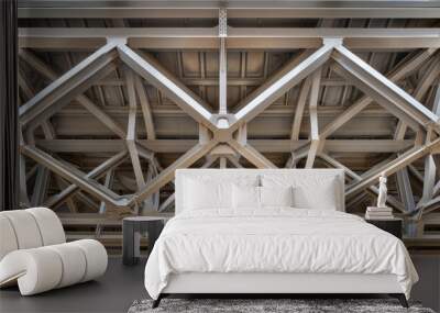 A view of a modern glass skylight with geometric metal framing, showing natural light coming through the ceiling Wall mural