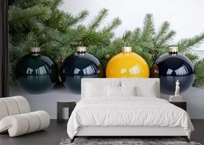 Colorful Christmas ornaments in black, yellow, and teal are arranged beautifully with festive greenery and shimmering lights Wall mural