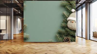 This close-up captures a Christmas tree wearing a Santa hat, set against a soft grey background, creating an inviting atmosphere for holiday-themed messages or products Wall mural