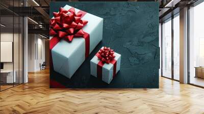 two white gift boxes adorned with vibrant red ribbon bows, one small and one large, elegantly isolated on a soft light background in a front-facing view. Wall mural